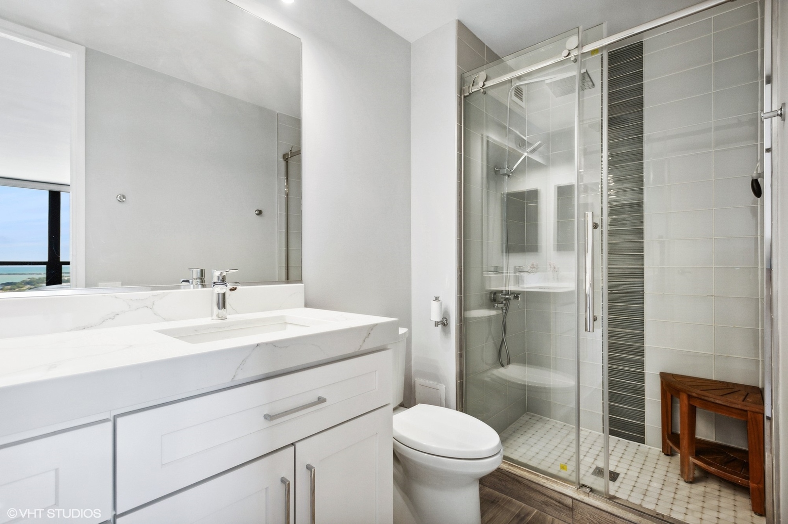 1030 North State Street, Unit 44E Chicago, IL 60610 - Photo 12 of 22 a bathroom with a sink toilet and shower