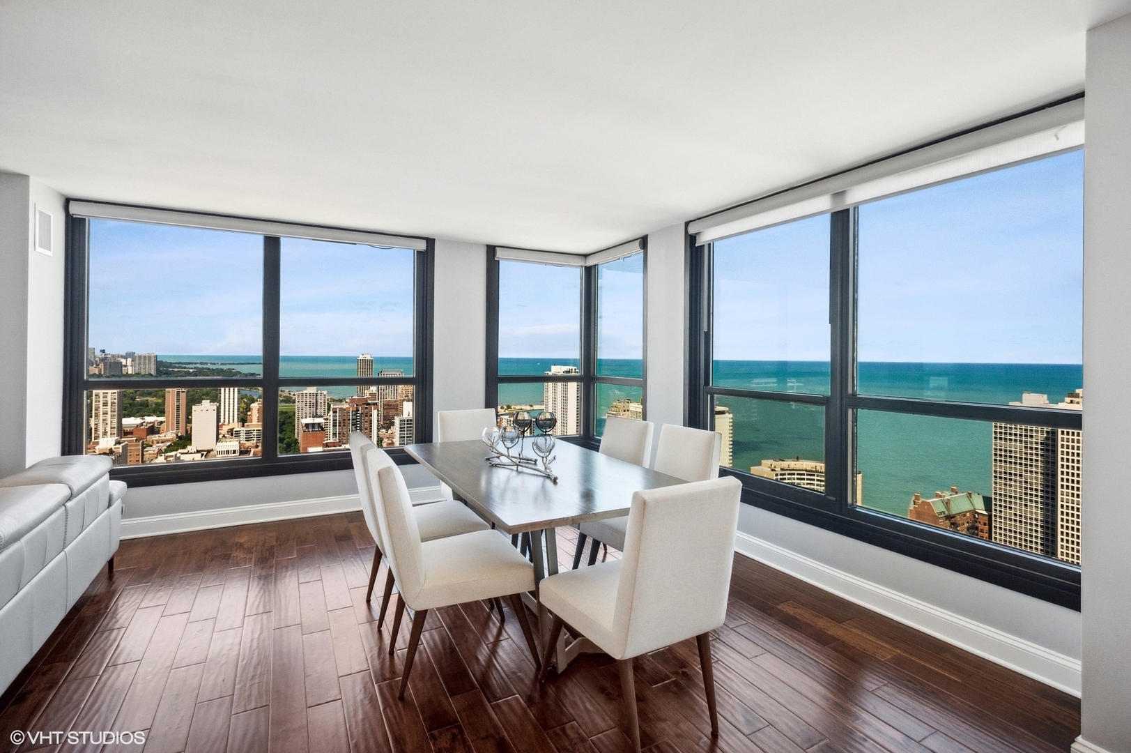 1030 North State Street, Unit 44E Chicago, IL 60610 - Photo 4 of 22 a dining room with furniture window and wooden floor
