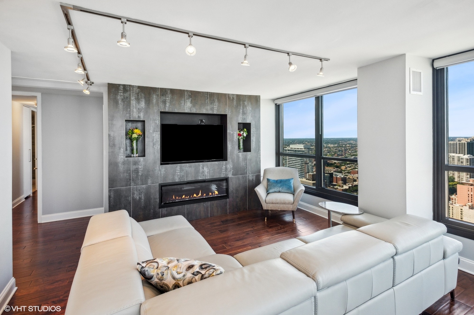 1030 North State Street, Unit 44E Chicago, IL 60610 - Photo 6 of 22 a living room with furniture and a flat screen tv