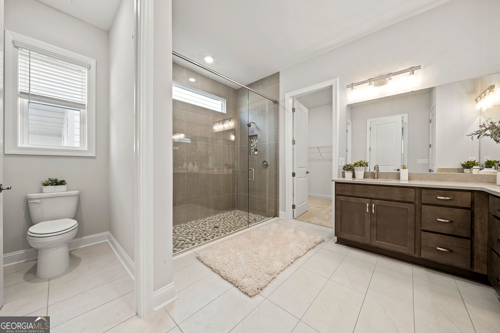 68 Ballyfin Way Newnan, GA 30263 - Photo 14 of 46 a bathroom with a granite countertop sink toilet and shower
