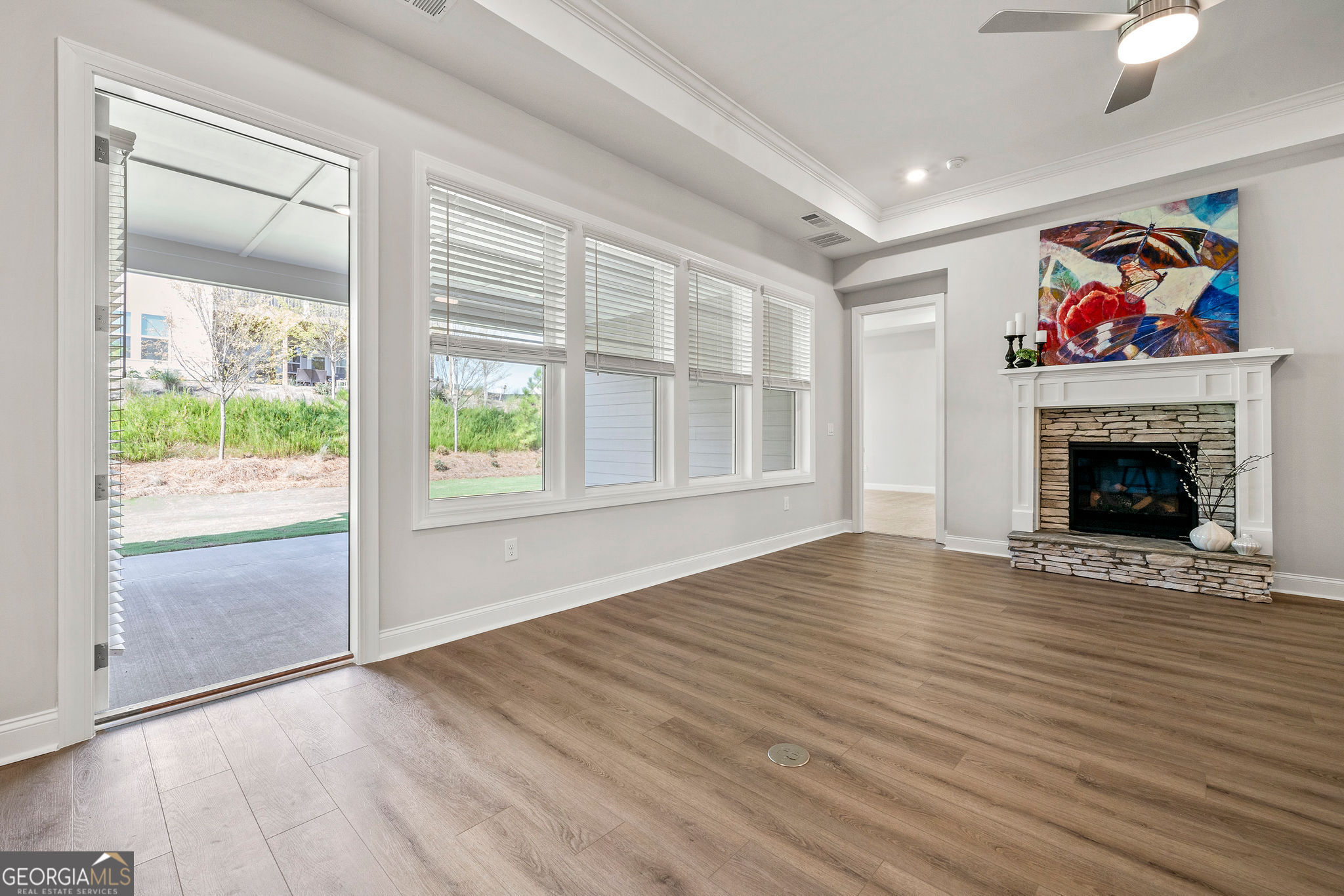 68 Ballyfin Way Newnan, GA 30263 - Photo 20 of 46 a view of an empty room with a window and a fireplace