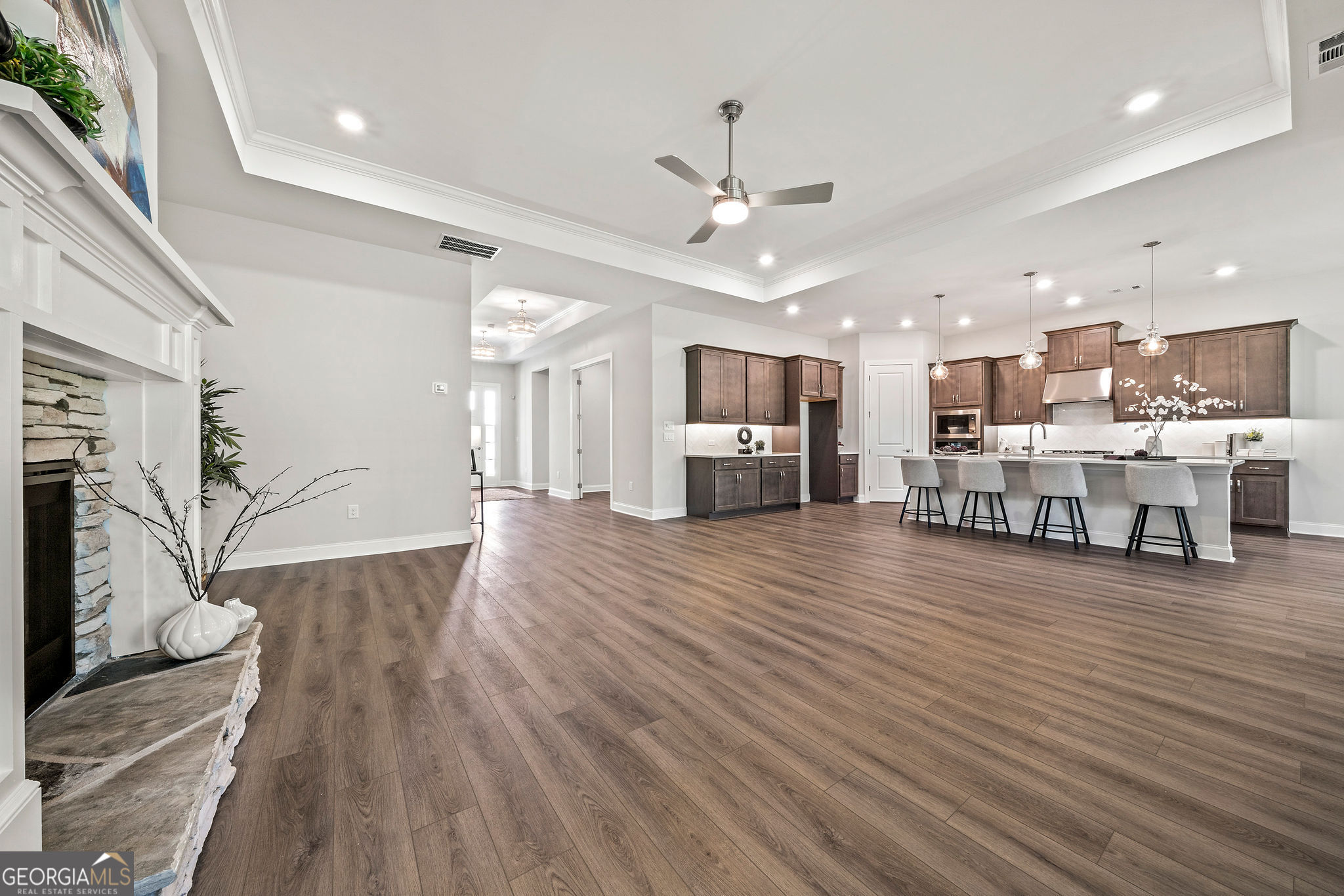 68 Ballyfin Way Newnan, GA 30263 - Photo 22 of 46 a living room with stainless steel appliances furniture wooden floor and a kitchen view