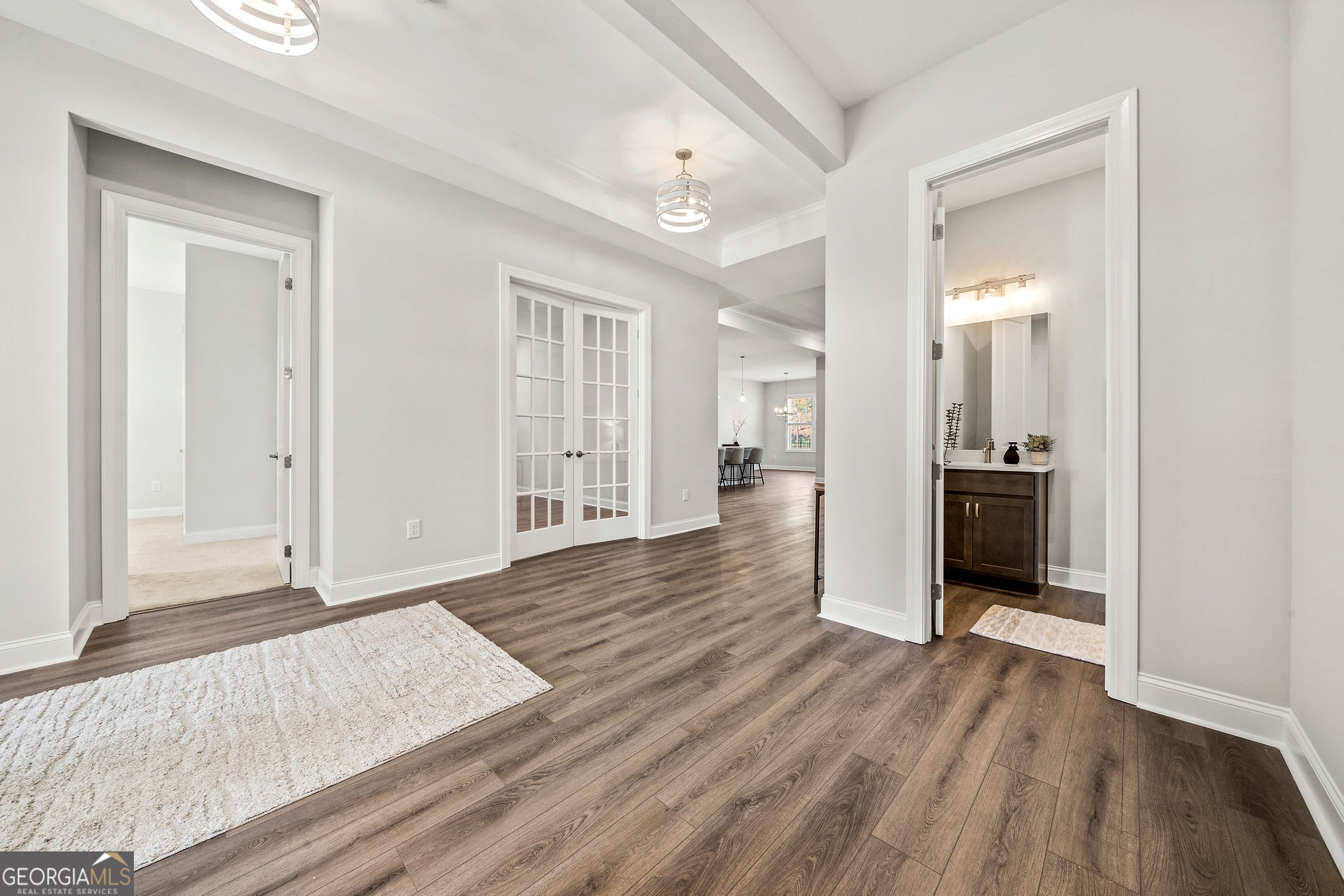 68 Ballyfin Way Newnan, GA 30263 - Photo 25 of 46 wooden floor in a hall with an entryway door