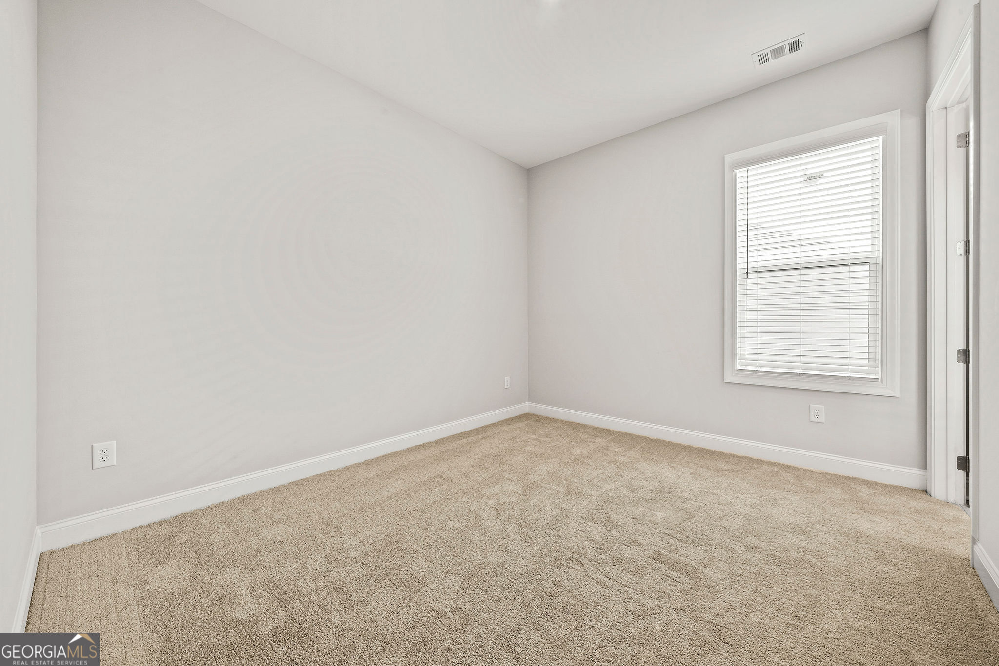 68 Ballyfin Way Newnan, GA 30263 - Photo 30 of 46 an empty room with a window