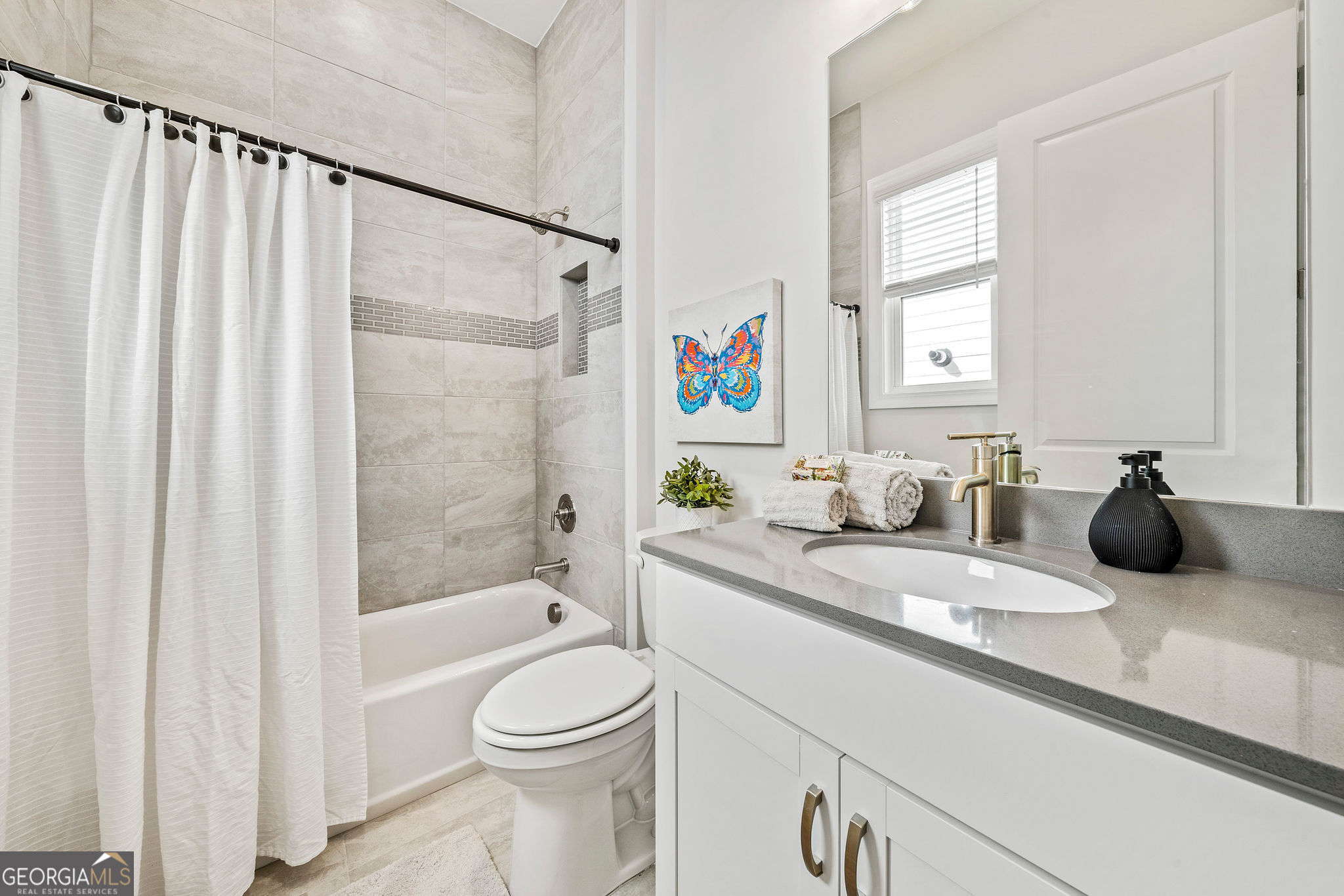 68 Ballyfin Way Newnan, GA 30263 - Photo 32 of 46 a bathroom with a granite countertop sink a toilet and shower