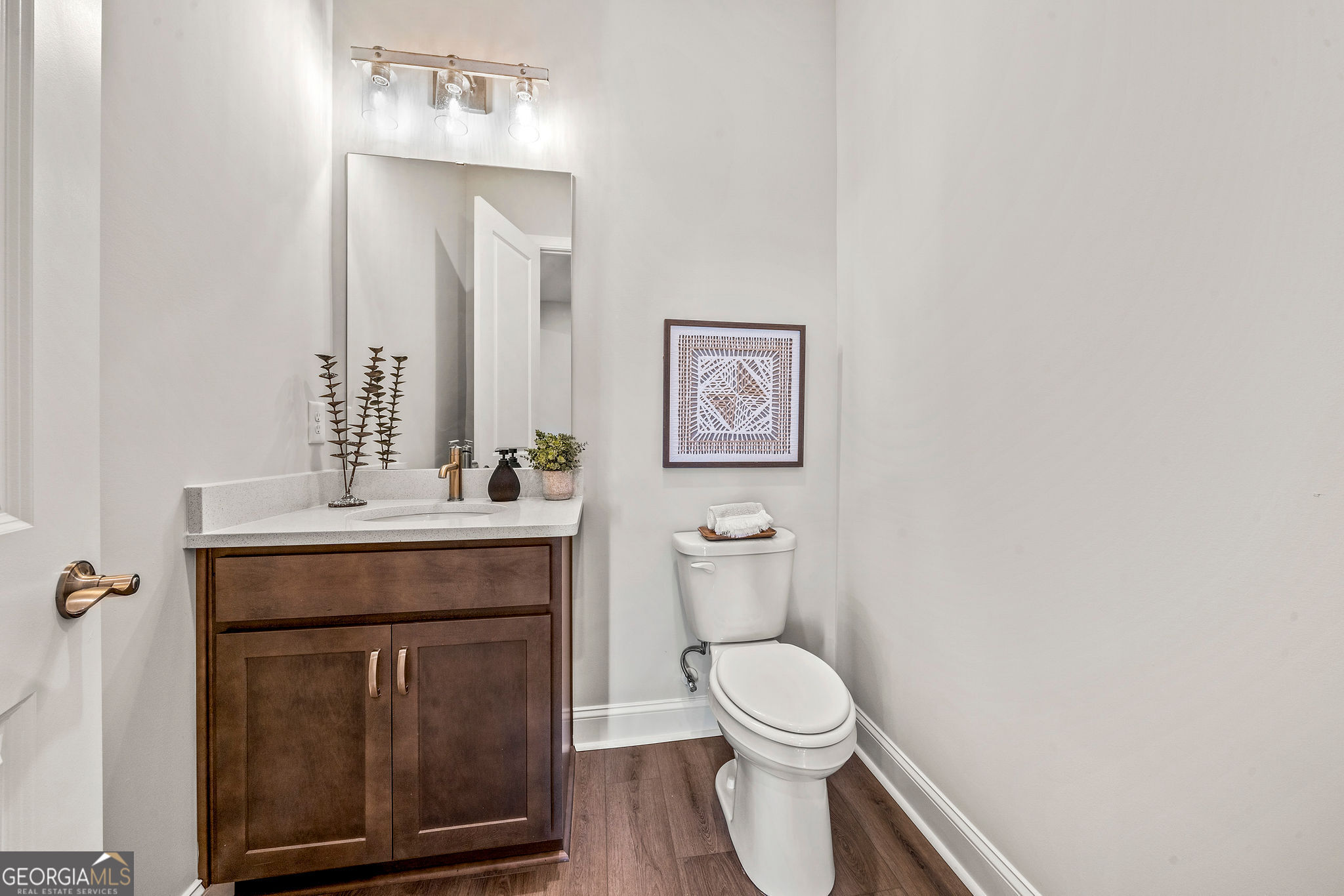 68 Ballyfin Way Newnan, GA 30263 - Photo 33 of 46 a bathroom with a toilet a sink and mirror