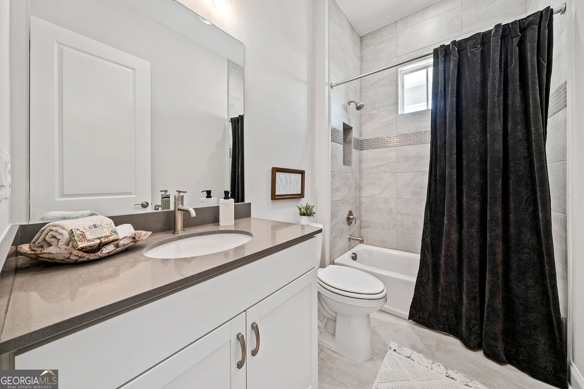 68 Ballyfin Way Newnan, GA 30263 - Photo 36 of 46 a bathroom with a sink a toilet and shower