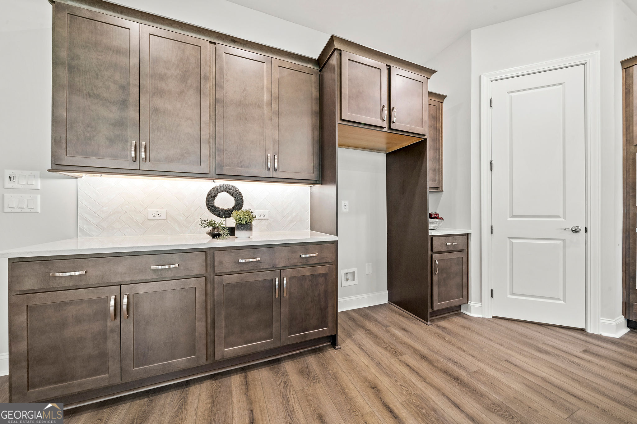 68 Ballyfin Way Newnan, GA 30263 - Photo 8 of 46 a view of cabinets and wooden floor