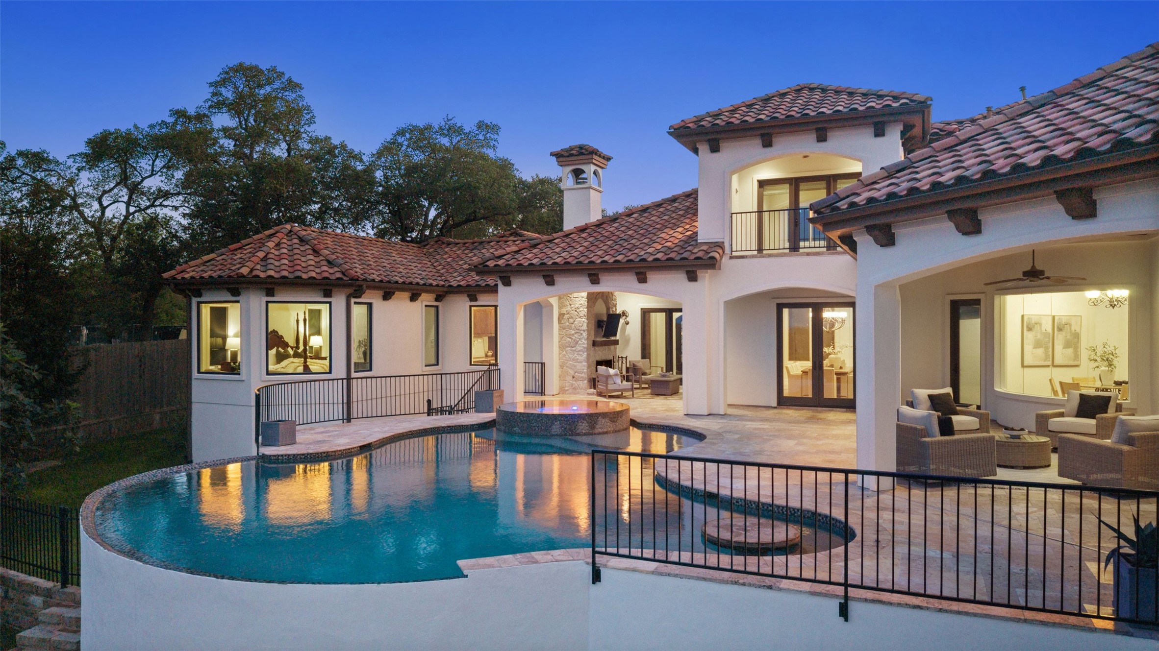1414 The High Road Austin, TX 78746 - Photo 39 of 40 A Mediterranean-inspired dwelling boasts a terraced pool and inviting outdoor lounge areas.