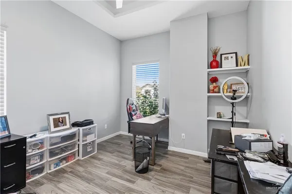 a room with furniture and wooden floor