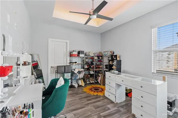 a view of a kitchen with workspace and wooden floor