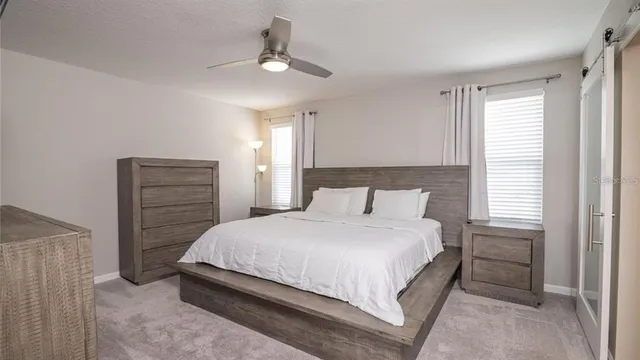 a bedroom with a bed and a dresser