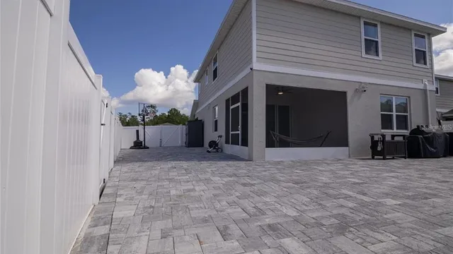 a view of a house with a potted plant in front of it