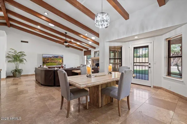 a bedroom with a bed and ceiling fan