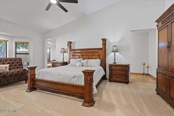 a view of a house with a yard and potted plants