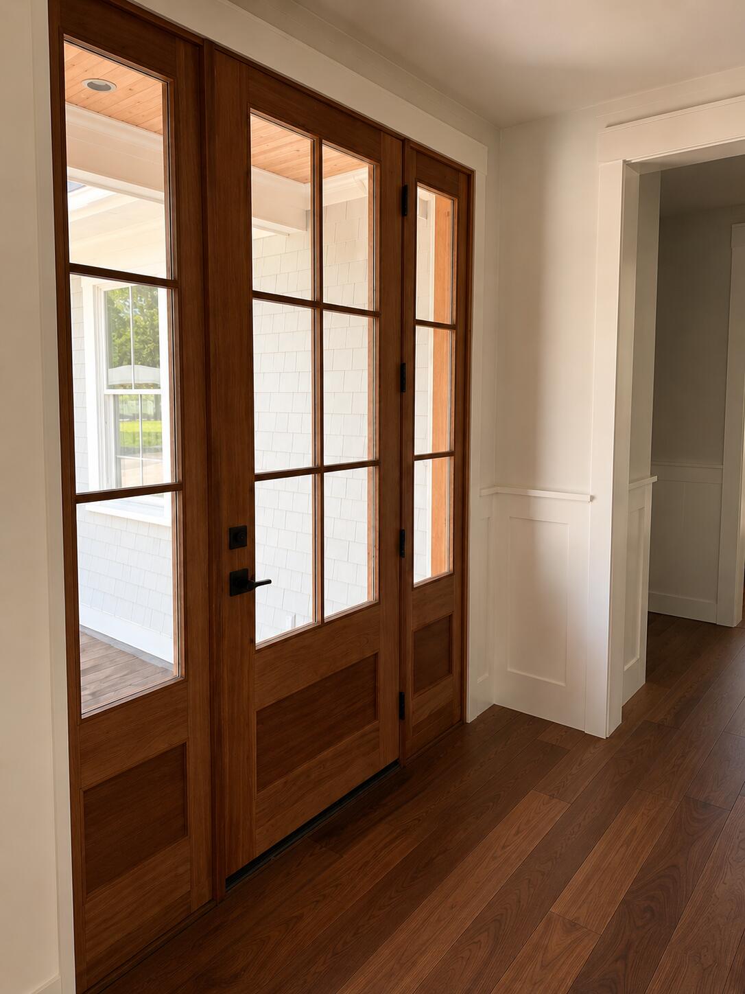 640 Poponessett Road Cotuit, MA 02635 - Photo 5 of 29 an empty room with wooden floor and windows