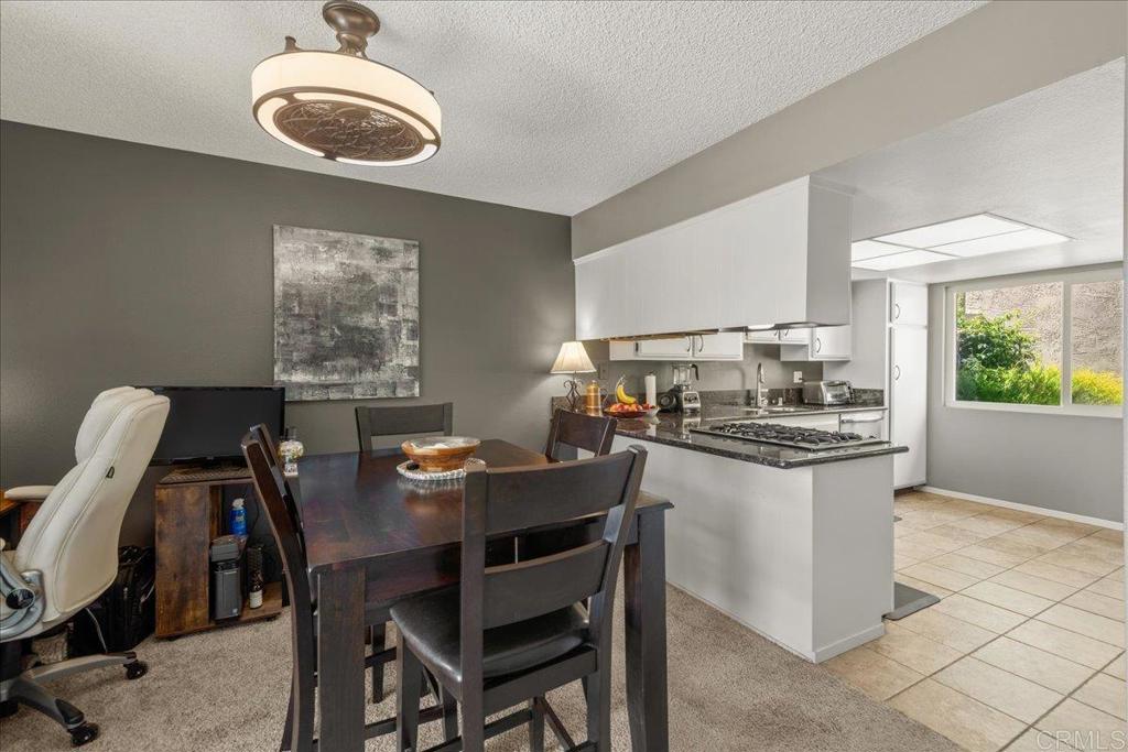 3047 Highlands Boulevard Spring Valley, CA 91977 - Photo 7 of 39 a kitchen with a table and chairs in it