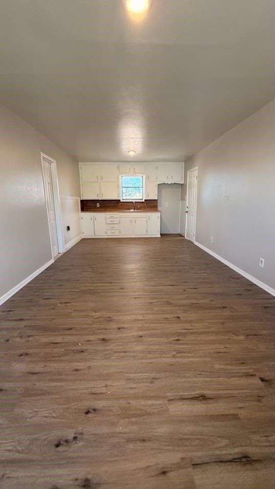 2414 Baylor Street Lubbock, TX 79415 - Photo 7 of 9 a view of empty room with wooden floor