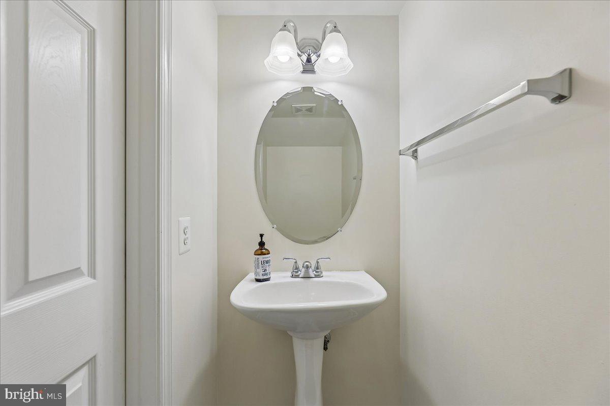 9276 Laurel Ridge Crossing Road Lorton, VA 22079 - Photo 22 of 43 Sleek and modern powder room design.