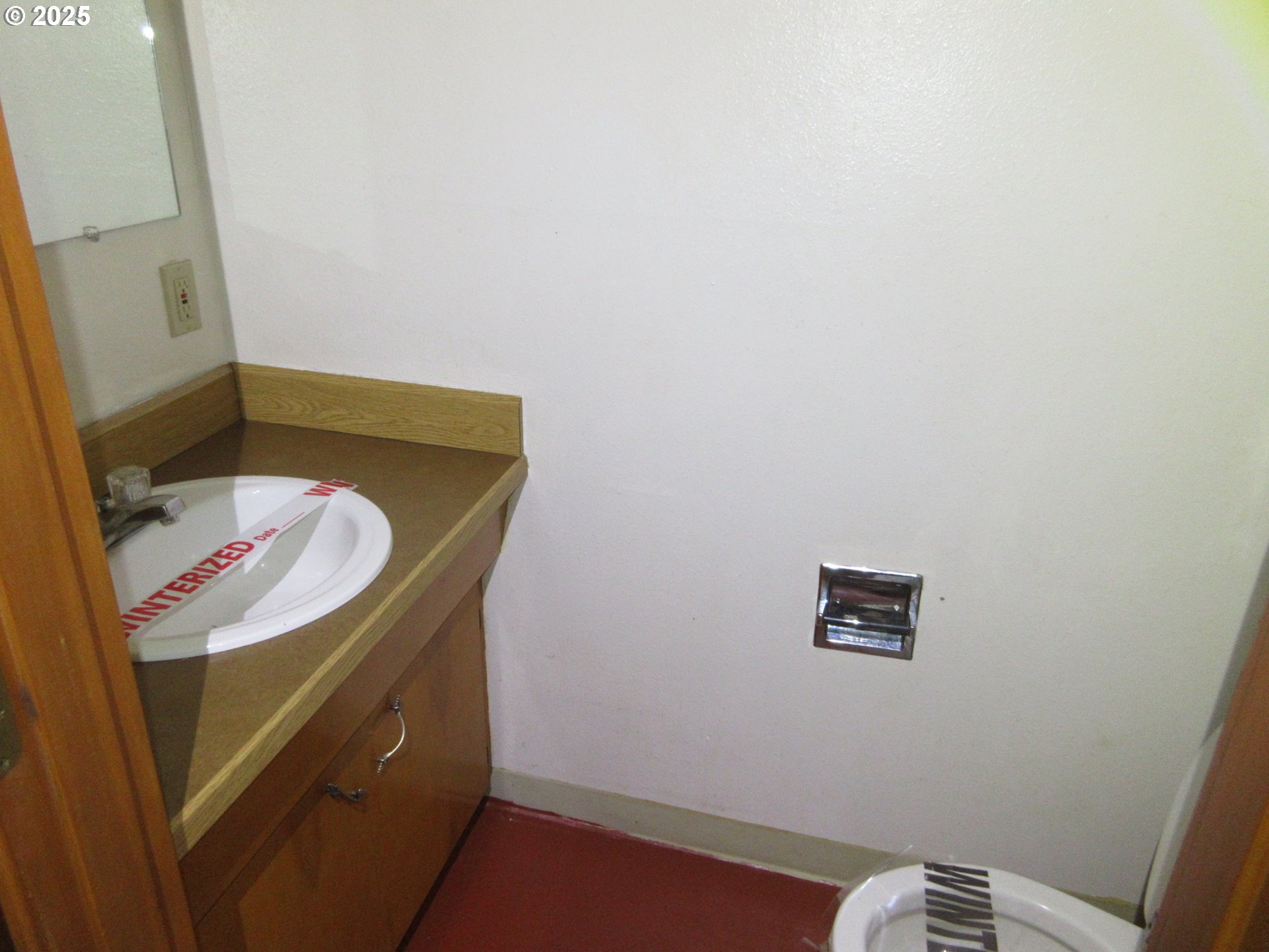 1308 Northeast Hogan Drive, Unit 166 Gresham, OR 97030 - Photo 5 of 13 a bathroom with a sink and a mirror