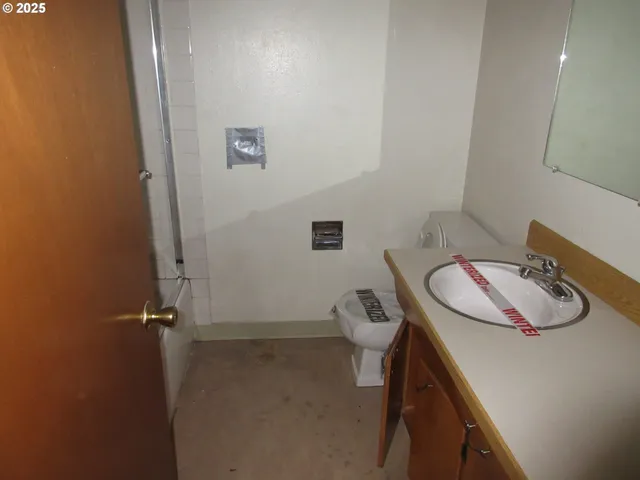 a bathroom with a sink and toilet