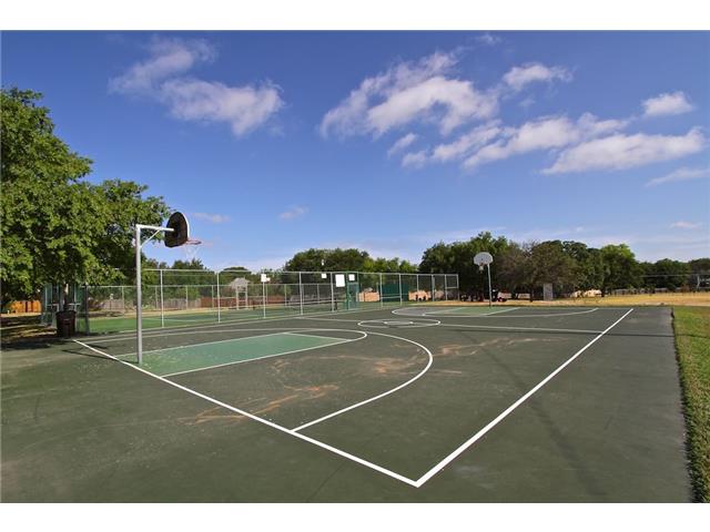 7006 Rambollet Terrace Round Rock, TX 78681 - Photo 31 of 38 An outdoor basketball court beckons for active recreation under a vast, open sky.