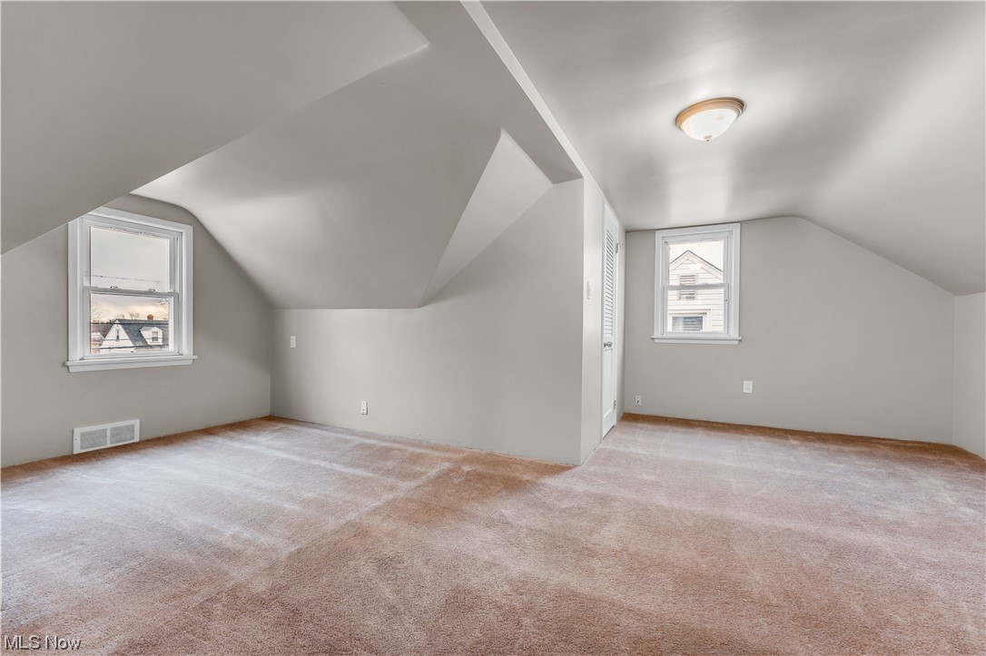 16301 Turney Road Maple Heights, OH 44137 - Photo 12 of 35 Dormer room featuring vaulted ceiling and light colored carpet