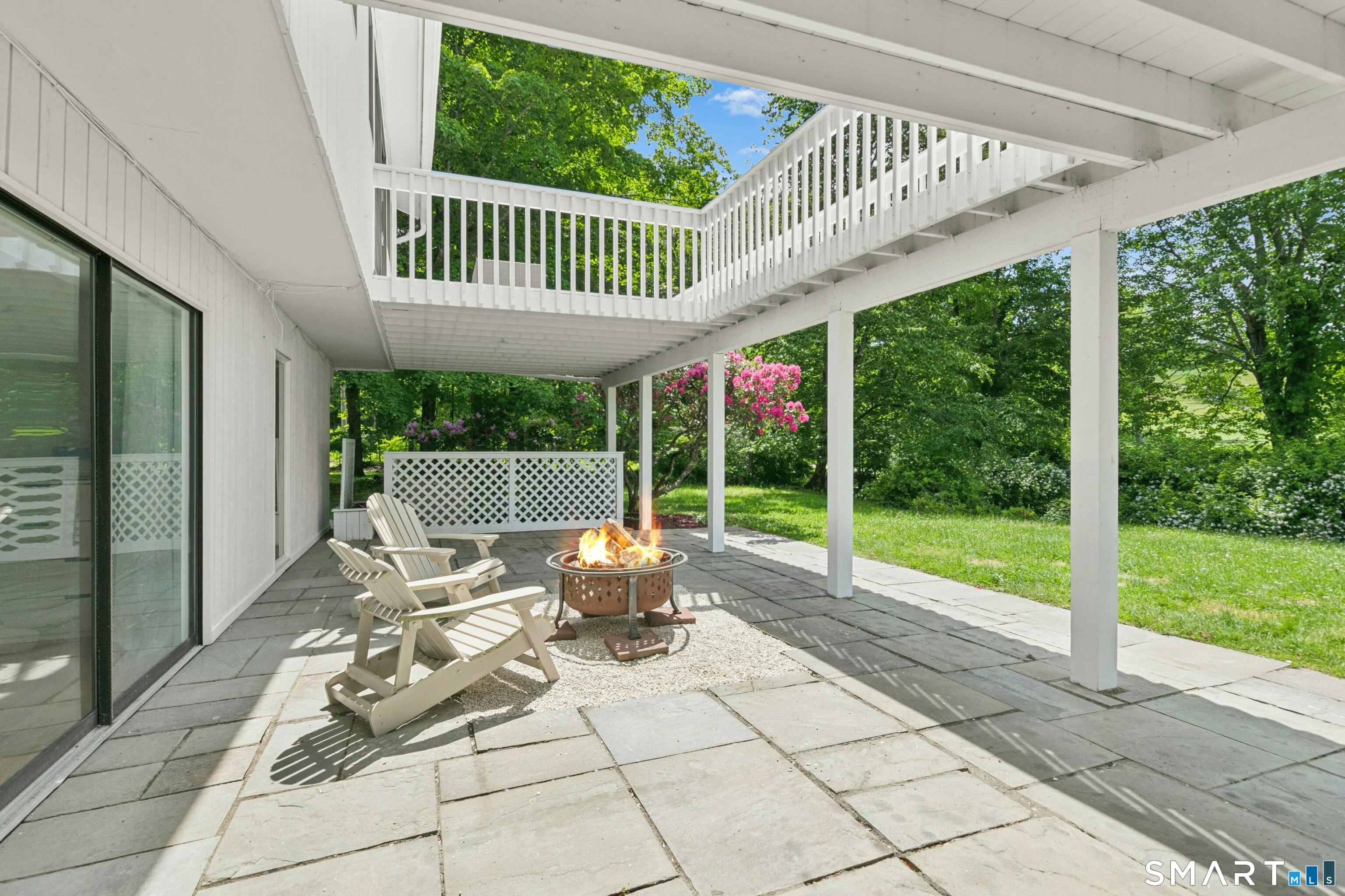 38 Old Redding Road Weston, CT 06883 - Photo 26 of 40 The Fire Pit in the Lower Level Patio is a beautiful place to enjoy this remarkable setting.