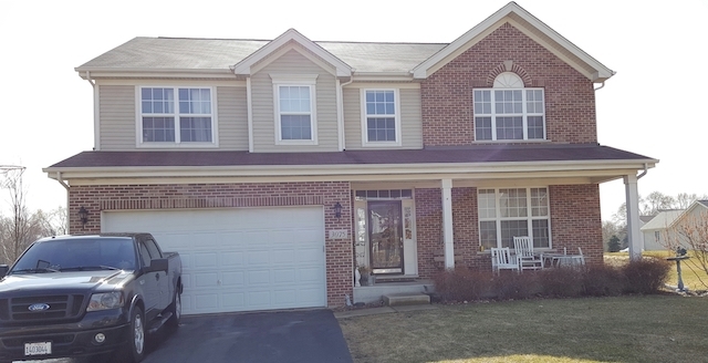 3075 Patterson Road Montgomery, IL 60538 - Photo 1 of 6 a front view of a house with a yard