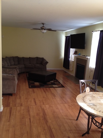 3075 Patterson Road Montgomery, IL 60538 - Photo 2 of 6 a living room with furniture and a flat screen tv