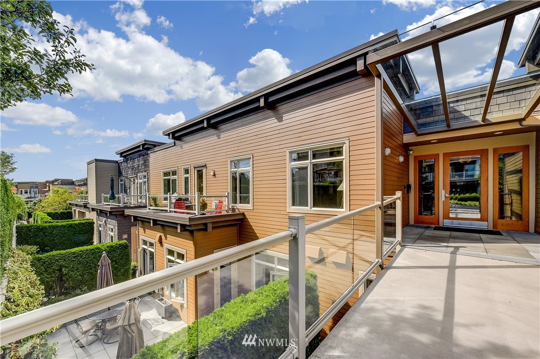 a view of a house with wooden deck