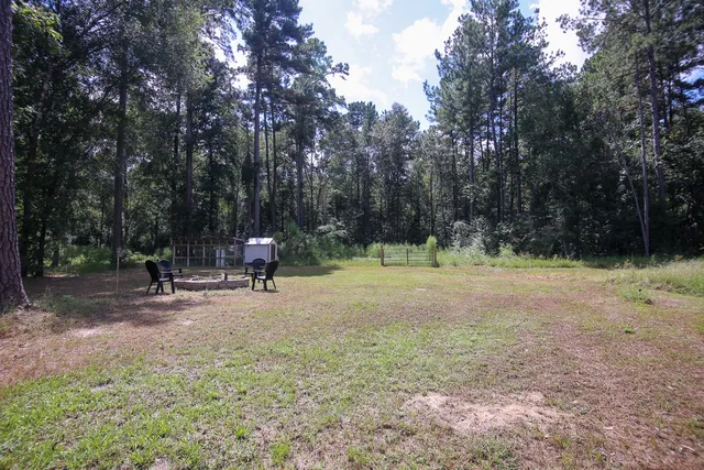 a view of outdoor space with deck and trees