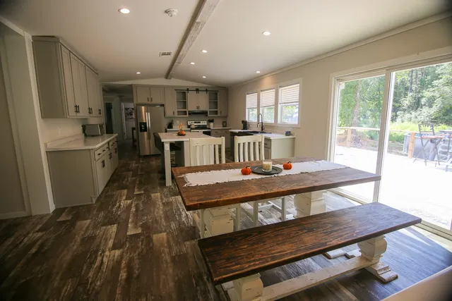 a view of a dining room with furniture window and wooden floor