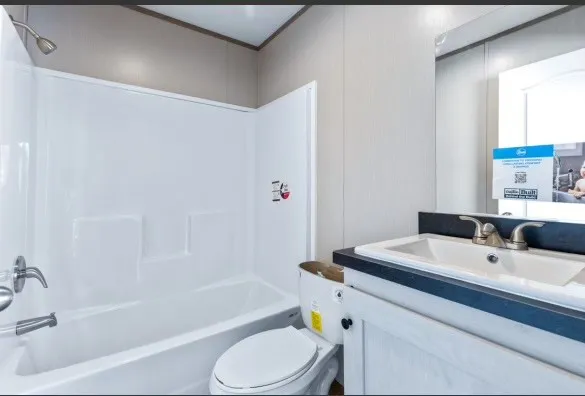 a bathroom with a sink a toilet and a bathtub