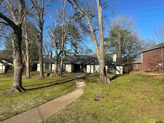 a house with trees in front of it