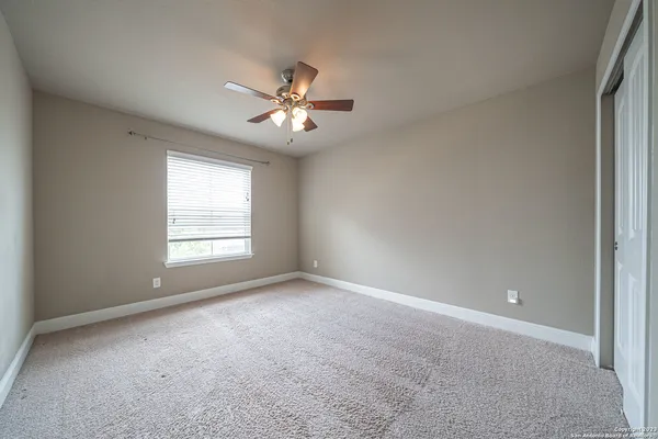 a view of empty room with fan