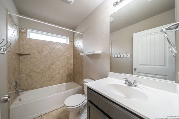 a bathroom with a sink a toilet and a bathtub