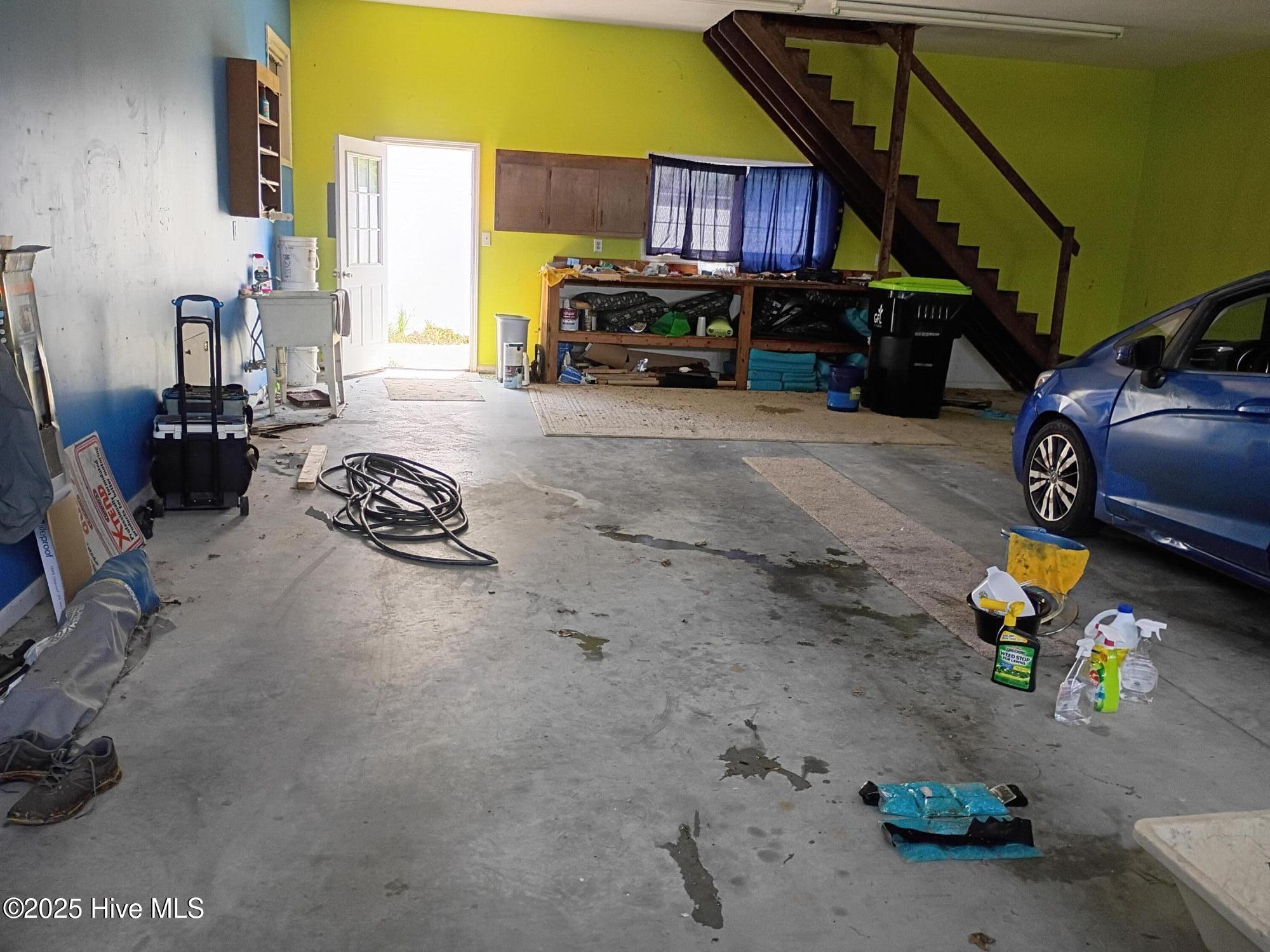 1099 Nautical Lane Southwest Calabash, NC 28467 - Photo 17 of 24 Garage toward the back access door toward the enclosed yard behind the house