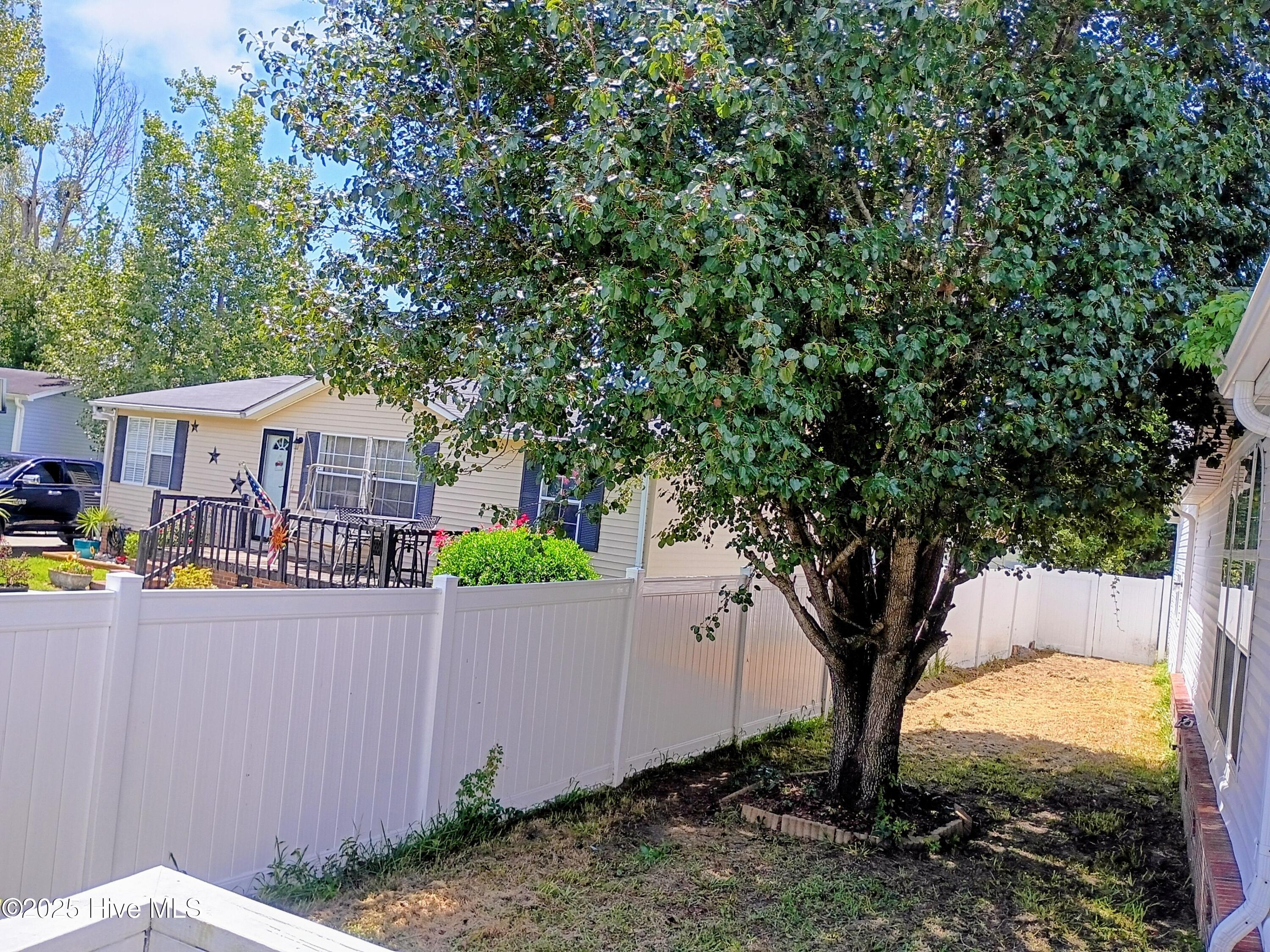 1099 Nautical Lane Southwest Calabash, NC 28467 - Photo 24 of 24 Backyard toward the garage