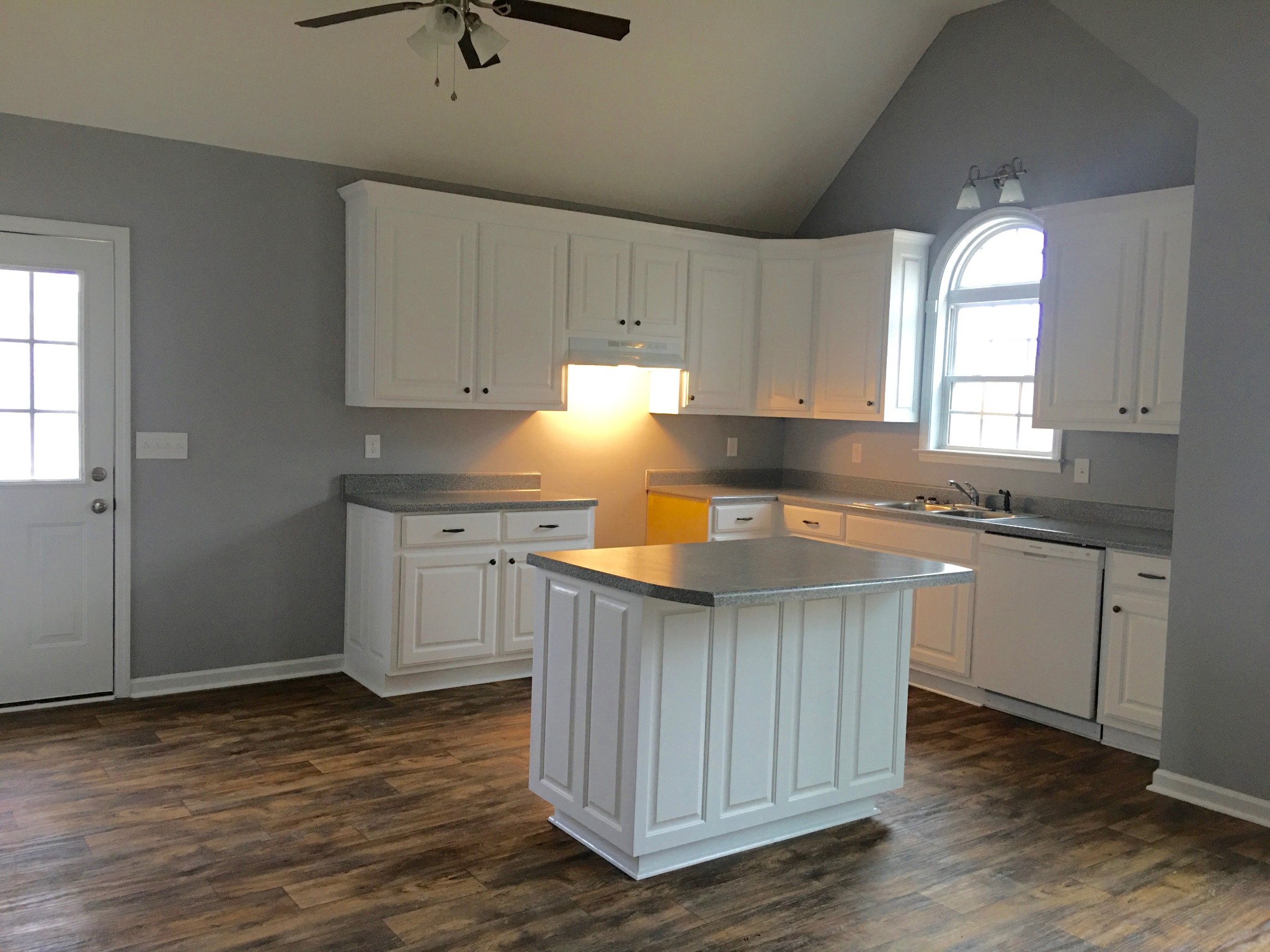 152 Limestone Road Elora, TN 37328 - Photo 3 of 18 a kitchen with granite countertop a sink cabinets and wooden floor