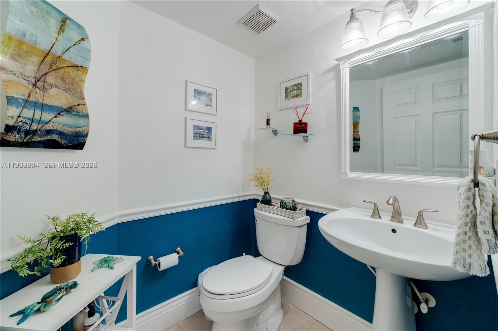 3197 Virginia Street Miami, FL 33133 - Photo 20 of 22 a bathroom with a sink toilet and a mirror