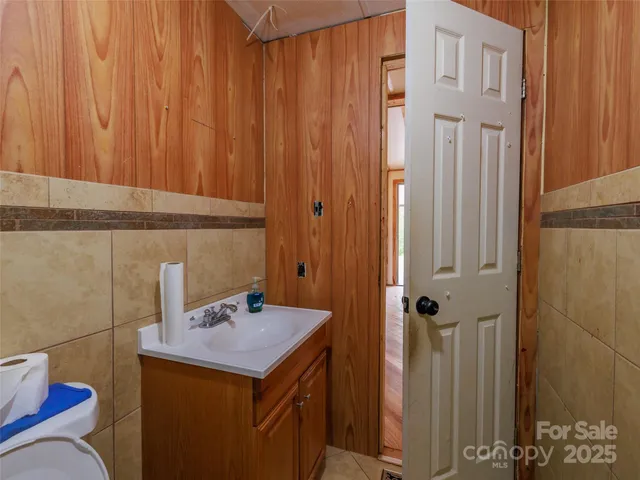 a bathroom with a sink and mirror