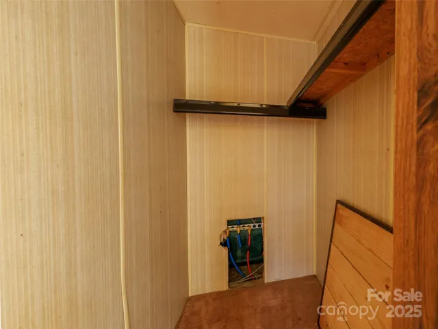 a bathroom with a granite countertop toilet sink and mirror