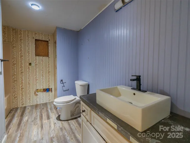 a bathroom with a shower and a tub