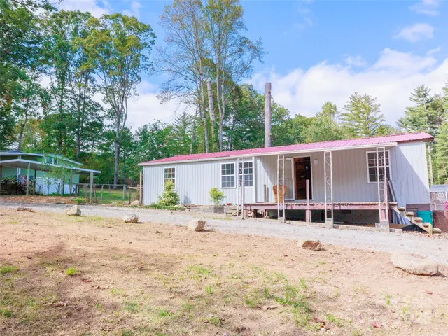 a house with trees in the background