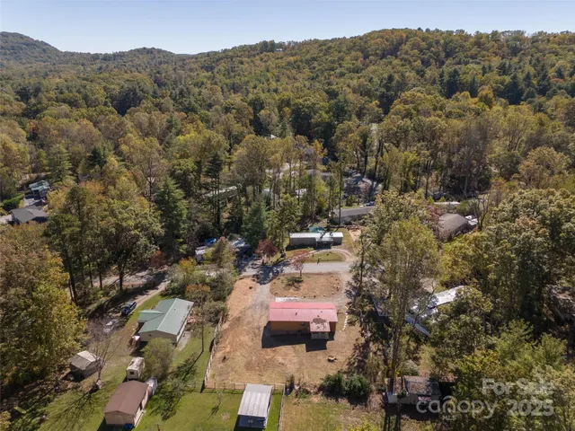 a view of a yard with snow on the road