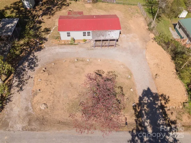 a aerial view of a house with a yard