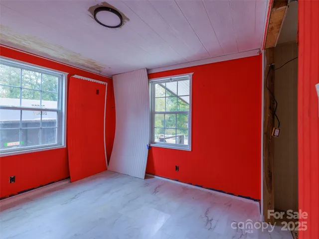 an empty room with windows