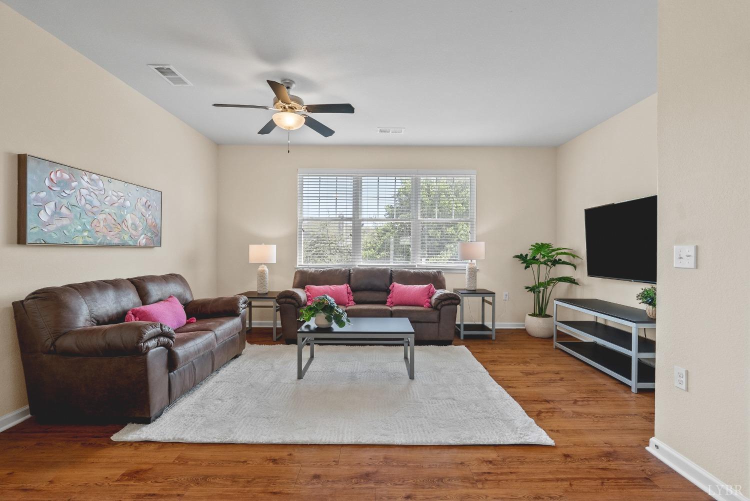 1600 Wards Ferry Road, Unit 704 Lynchburg, VA 24502 - Photo 11 of 49 a living room with furniture and a flat screen tv