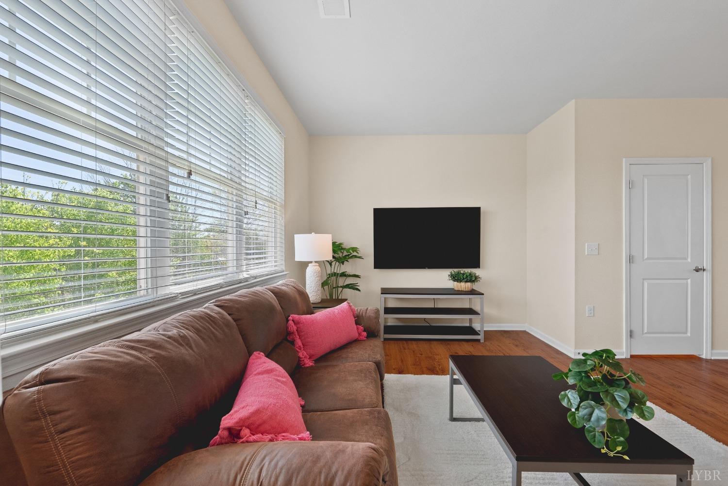1600 Wards Ferry Road, Unit 704 Lynchburg, VA 24502 - Photo 13 of 49 a living room with furniture and a flat screen tv